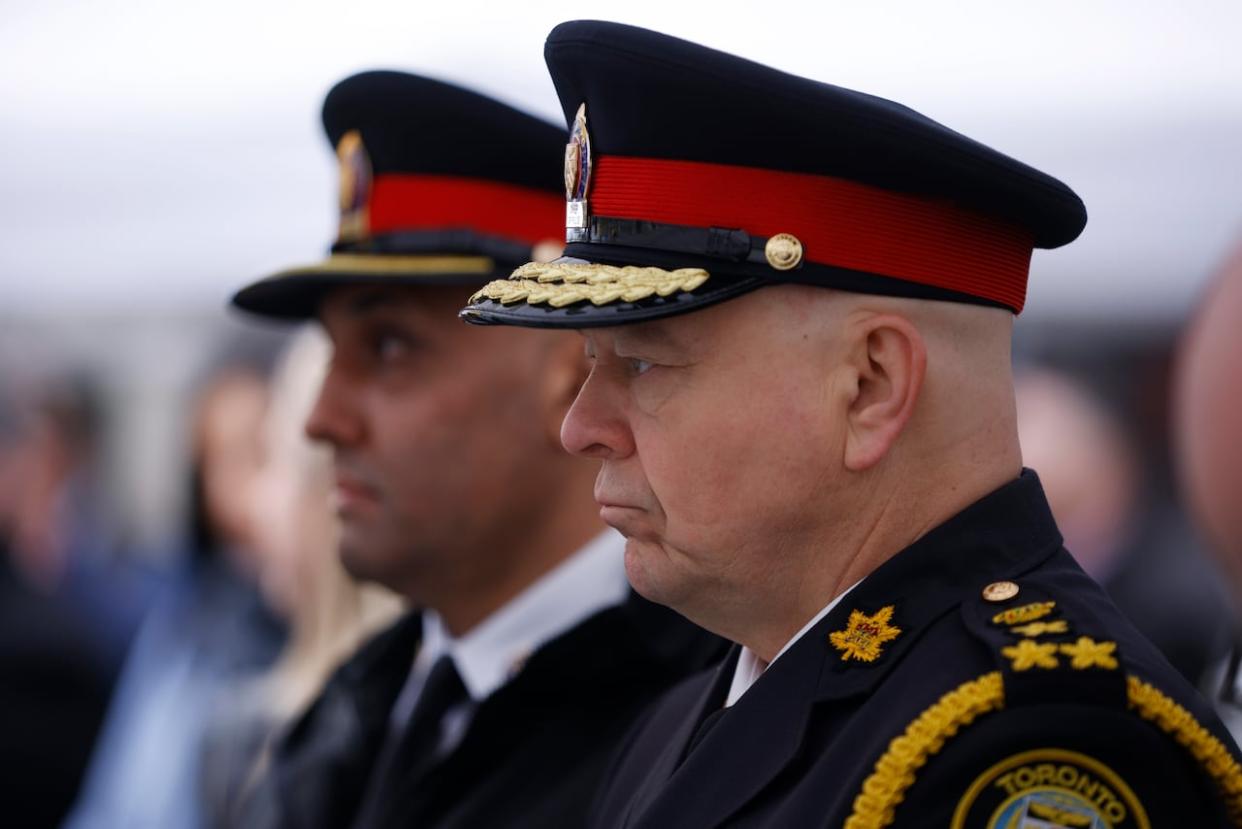 Toronto police Chief Myron Demkiw, right, shown in May 2023, apologized Sunday for the 'concern and confusion' caused by officers handing coffee to protesters. (Cole Burston/The Canadian Press - image credit)