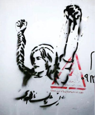 Iranian street art shows a woman raising her arms, with fists clenched. <a href="https://www.instagram.com/khiabantribune/" rel="nofollow noopener" target="_blank" data-ylk="slk:Khiaban Tribune via Instagram;elm:context_link;itc:0" class="link ">Khiaban Tribune via Instagram</a>