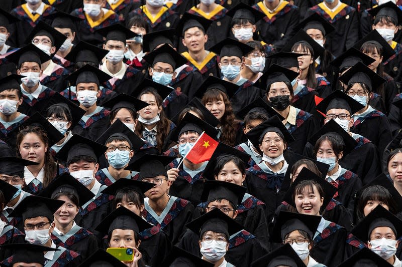 Graduates attend their ceremony at Huazhong University of Science and Technology on June 22, 2022 in Wuhan, Hubei, China. According to the Ministry of Education of China, the number of college graduates will reach 10.76 million in 2022.