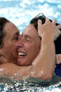 The Italian players celebrate their win during the Women's Water Polo Gold Medal match at the Olympic Aquatic Centre on August 26, 2004 during the Athens 2004 Olympic Games. (Photo by Chris Ivin/Getty Images)