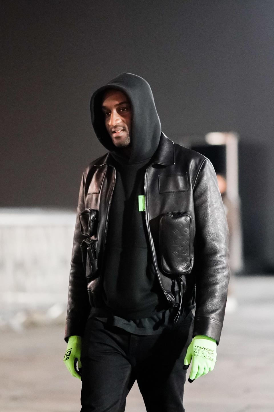 Virgil Abloh wears a black hoodie sweater during Paris Fashion Week