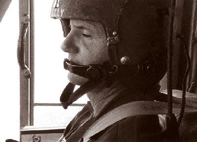 Maj. Charles Kelly catching a nap in his Huey,  UH1B in Vietnam, during his time as commander of the 57th Medical Detachment.