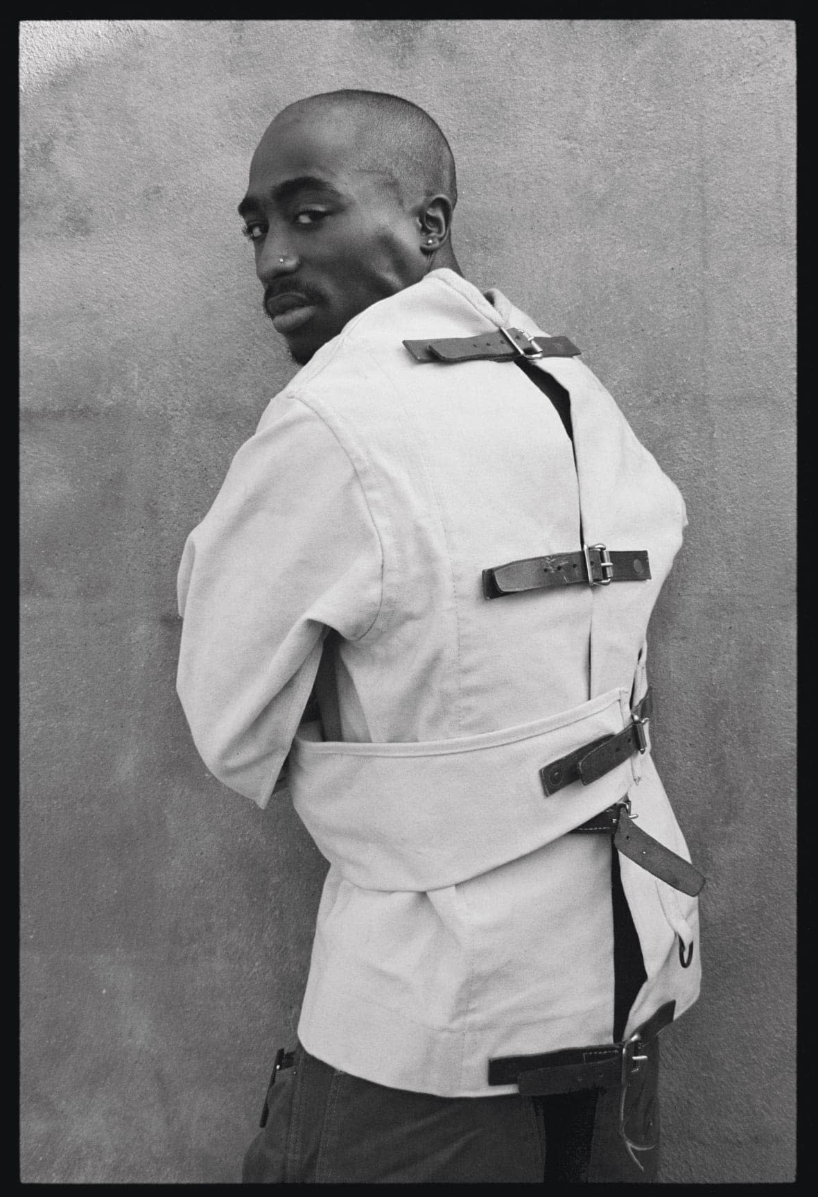 An image of 2Pac in a straight jacket is featured in the West Coast section of “Hip-Hop: Conscious, Unconscious.” (Photo by Shawn Mortensen – Provided by SME)