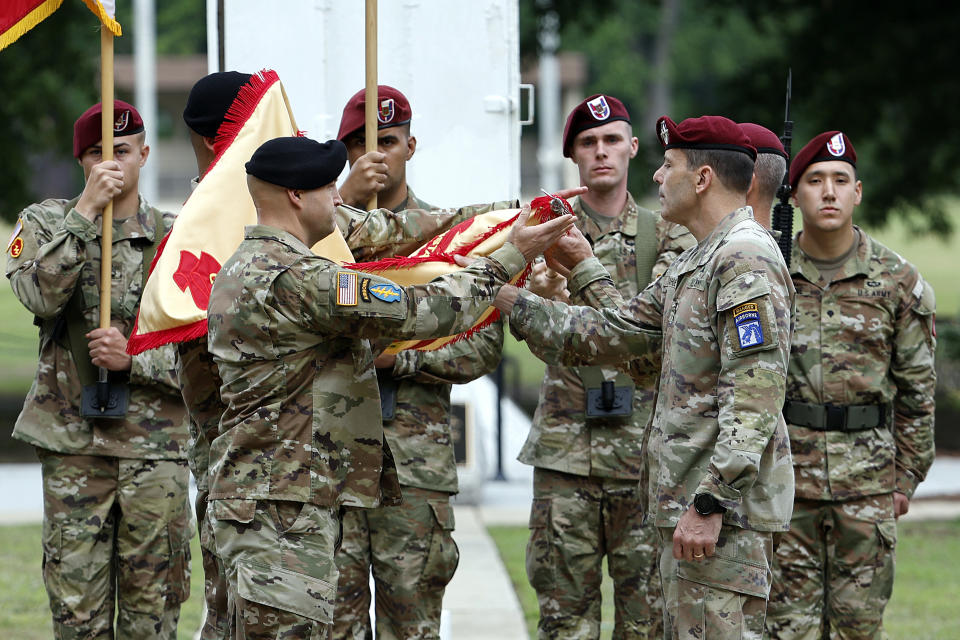 Lt. Gen. Christopher T. Donahue, front right, takes part in the Casing of the Colors during a renaming ceremony Friday, June 2, 2023, in Fort Liberty, N.C. The U.S. Army changed Fort Bragg to Fort Liberty as part of a broader initiative to remove Confederate names from bases. (AP Photo/Karl B DeBlaker)