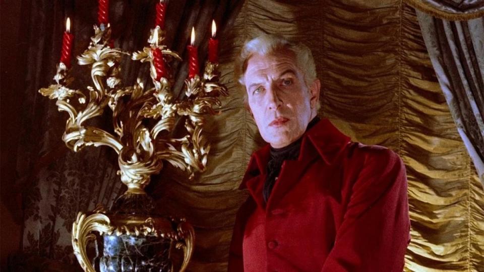 Vincent Price looms near a candelabra in House of Usher (1960).