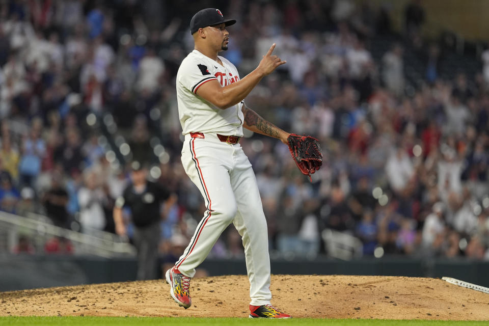 Minnesota Twins relief pitcher Jhoan Duran celebrates after forcing the final out to defeat the Detroit Tigers 5-3 of a baseball game Tuesday, July 2, 2024, in Minneapolis. (AP Photo/Abbie Parr)