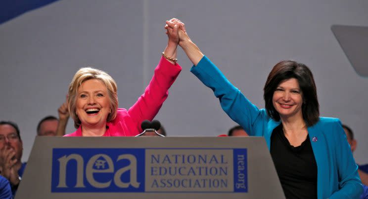 Democratic presidential candidate Hillary Clinton clasps hands with NEA President Lily Eskelsen Garcia at the NEA's 95th Representative Assembly in Washington on July 5. (Photo: Kevin Lamarque/Reuters)