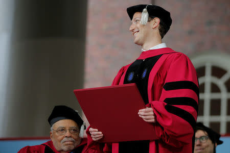 Facebook founder Mark Zuckerberg holds his honorary Doctor of Laws degree during the 366th Commencement Exercises at Harvard University in Cambridge, Massachusetts, U.S., May 25, 2017. REUTERS/Brian Snyder