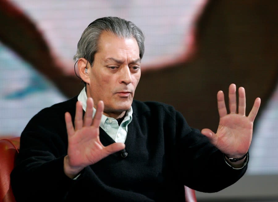 FILE – American writer Paul Auster gestures during the taping of the TV show “Che tempo che fa”, in Milan, Italy, March 25, 2009. Paul Auster, a prolific, prize-winning man of letters and filmmaker known for such inventive narratives and meta-narratives as “The New York Trilogy” and “4 3 2 1,” has died at age 77. (AP Photo/Antonio Calanni, File)