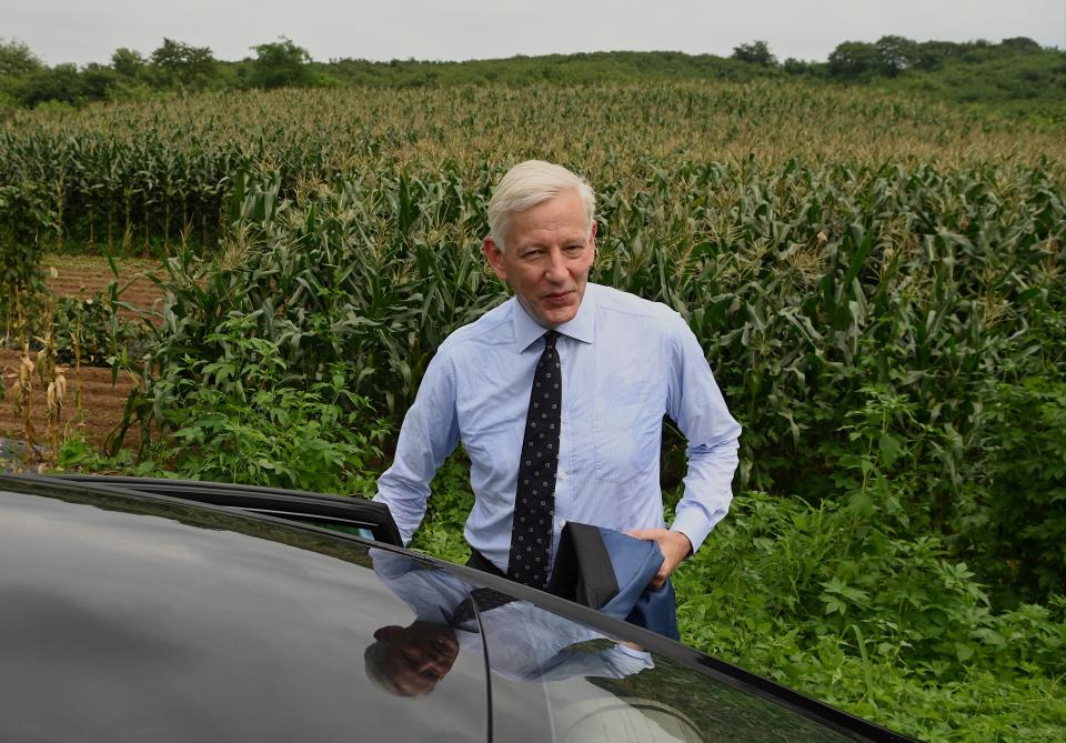 Canadian Ambassador Dominic Barton gets into a car near the Dandong city detention center after attending the guilty verdict hearing on Canadian businessman Michael Spavor on spying charges in the border city of Dandong, in China's northeast Liaoning province on 11 August 2021 (AFP via Getty Images)