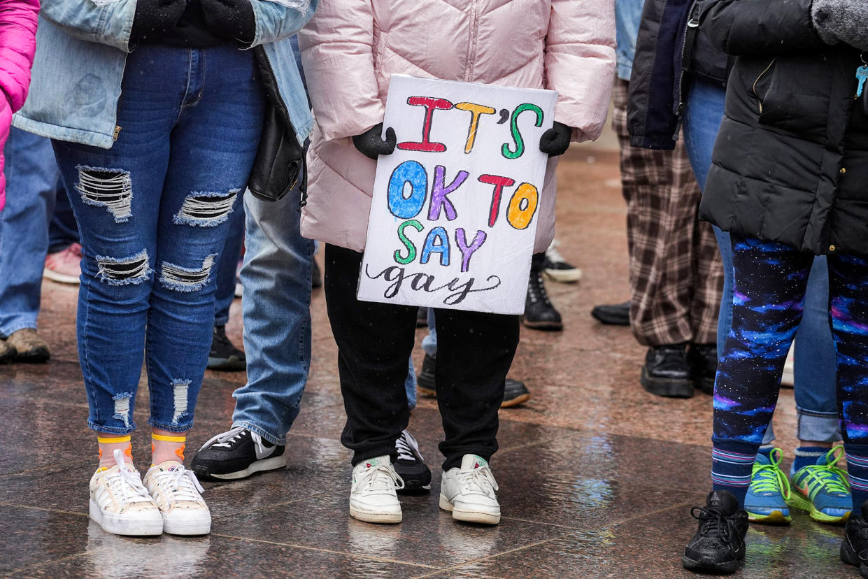 Outside the Ohio Statehouse, people protest against HB 616, Ohio's 