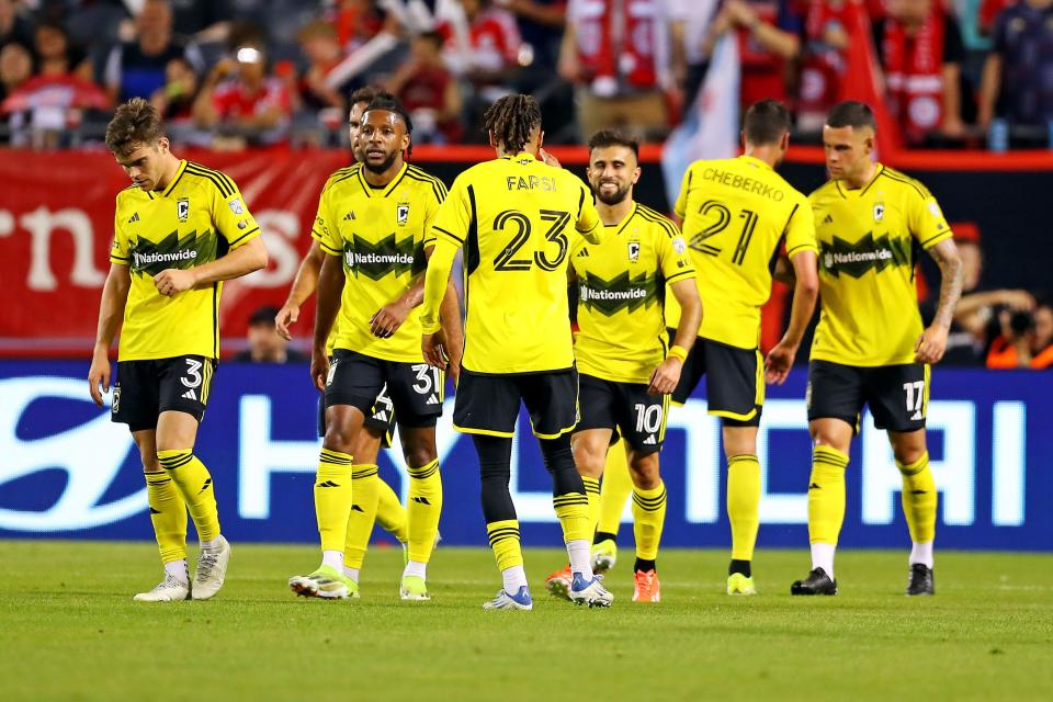 Crew forward Diego Rossi (10) celebrates with Mohamed Farsi (23) after scoring a goal against Chicago on Saturday.