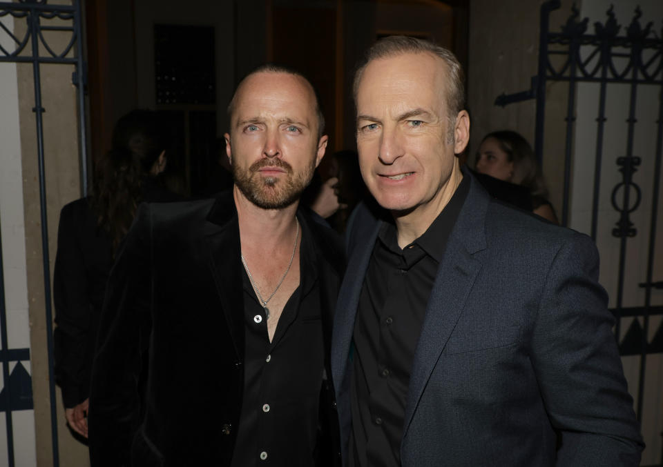 LOS ANGELES, CALIFORNIA - APRIL 07: Aaron Paul (L) and Bob Odenkirk pose at the after party for the premiere of the sixth and final season of AMC's 
