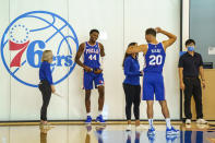 Philadelphia 76ers forward Paul Reed, (44) and Georges Niang, right, talk things over as they move from section to section during the NBA basketball team's Media Day in in Camden, N.J., Monday, Sept. 27, 2021. (AP Photo/Chris Szagola)