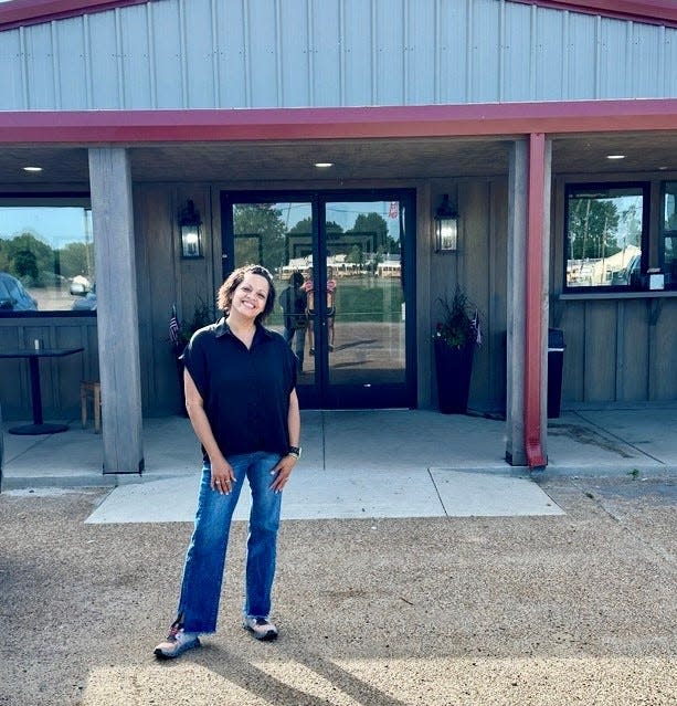 Tracy Harden stands outside Chuck's Dairy Bar Wednesday, June 12. Chuck's re-opened June 7 in its new building after nearly 15 months working in a trailer since a tornado ripped through Rolling Fork in March of 2023.