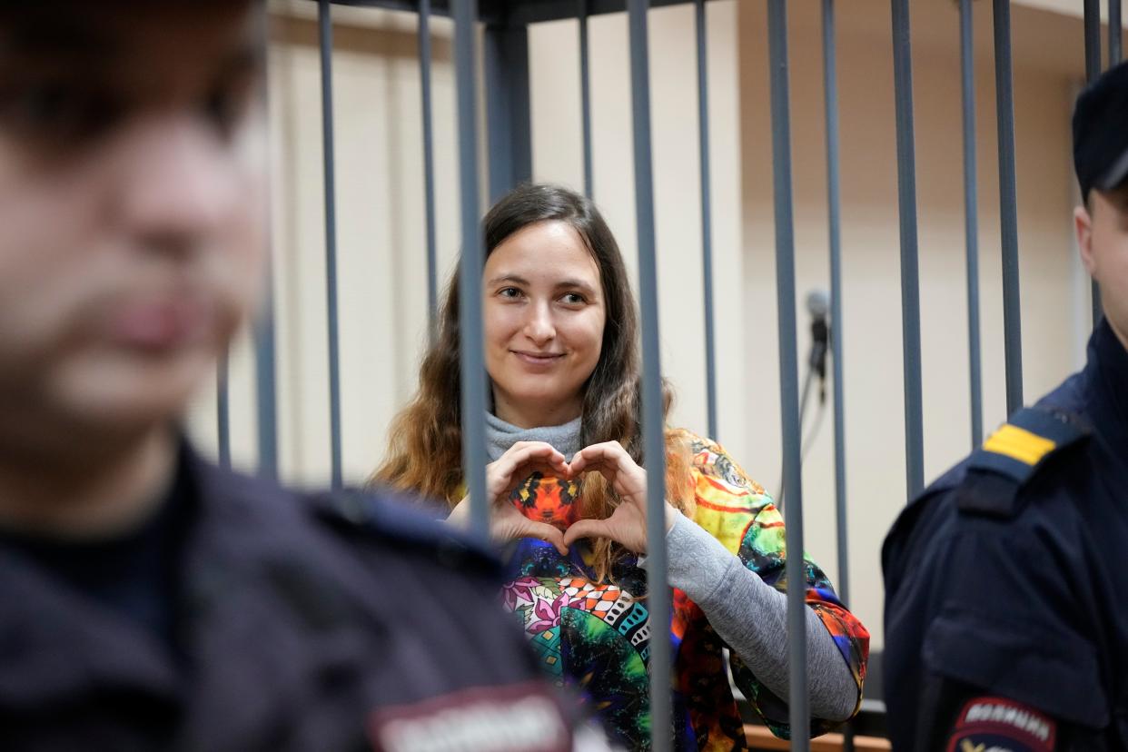Sasha Skochilenko made the sign for love with her hands during her trial on Thursday (Copyright 2023 The Associated Press. All rights reserved)