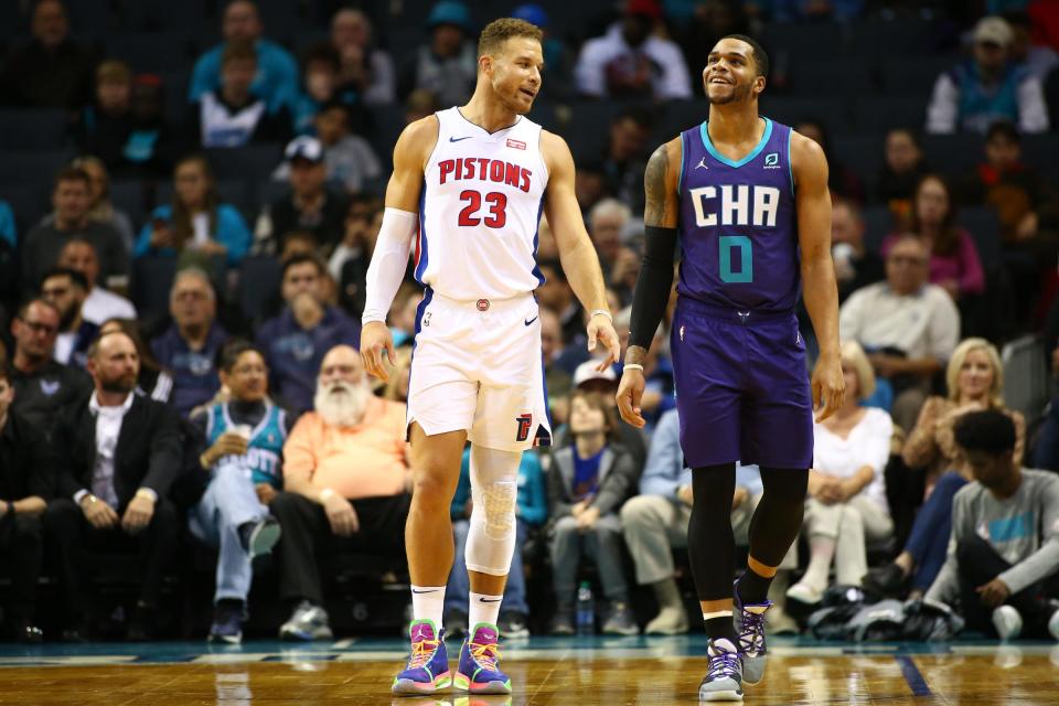 Detroit Pistons forward Blake Griffin laughs with Charlotte Hornets forward Miles Bridges during the first half in Charlotte, N.C., Nov. 27, 2019.