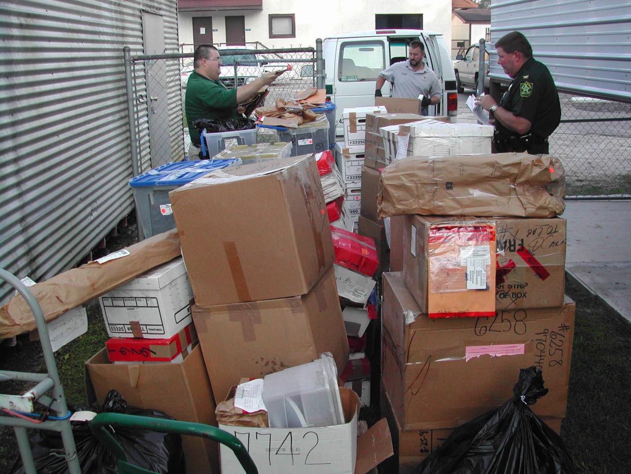 In this 2005 photo, Nassau County sheriff's officers catalog boxes of confiscated drugs, stockpiled for nearly a decade, before loading them to be destroyed.