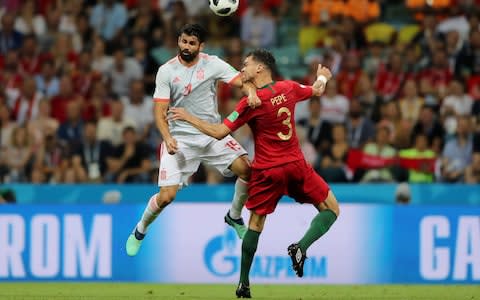 Diego Costa of Spain battles for possession with Pepe of Portugal during the 2018 FIFA World Cup Russia group B match between Portugal and Spain - Is VAR getting it right in Russia? - Credit: Simon Hofmann/FIFA