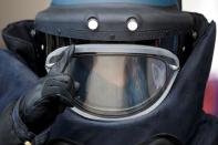 EOD officer wears protective suit during media tour of EOD depot of Hong Kong police, in Hong Kong