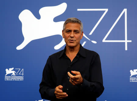 Actor and director George Clooney gestures during a photocall for the movie "Suburbicon" at the 74th Venice Film Festival in Venice, Italy September 2, 2017. REUTERS/Alessandro Bianchi/Files