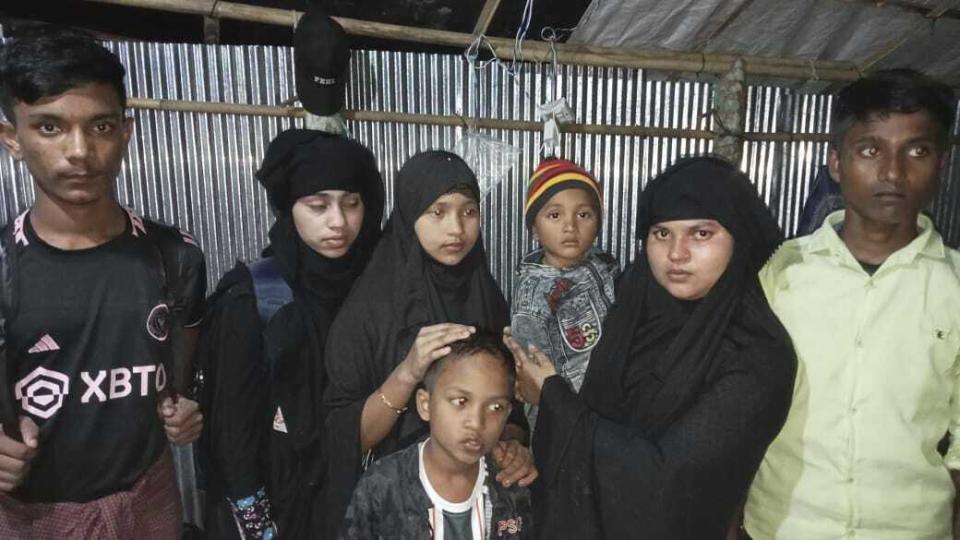 This photo provided by Mohammed Taher, a Rohingya refugee, shows several of his relatives posing for a photo in Teknaf, Bangladesh, on Nov. 10, 2023. Six of the people in the photo boarded a boat bound for Indonesia that broke down at sea and went missing in a storm. Far left is Ayas, 15. The woman, second from left, is not Taher's relative and she didn't board the boat. From third left are Somiya, 13, Abdullah, 4, at front, Junaid, 3, Tosmin Ara, 25, and Mohammed Amin, 15. (Courtesy of Mohammed Taher via AP)