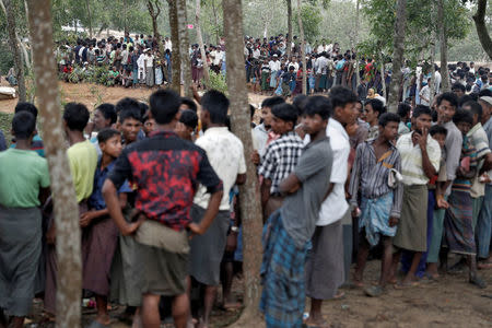 Rohingya refugees wait to receive aid in Cox's Bazar, Bangladesh, September 25, 2017. REUTERS/Cathal McNaughton