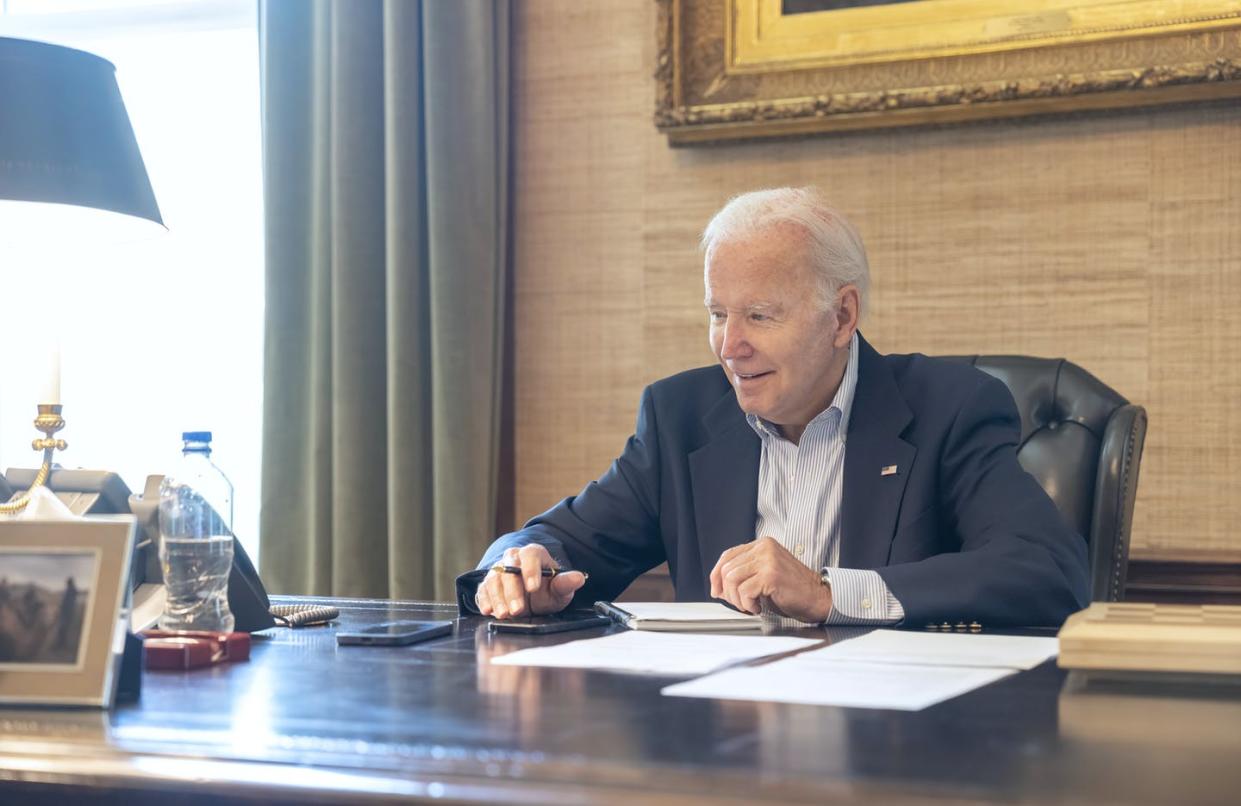 President Joe Biden tested positive for COVID-19 on July 21, 2022, but was reportedly feeling well enough to work and take calls, as seen in this photo released by the White House. <a href="https://newsroom.ap.org/detail/VirusOutbreakBidenCOVID/81ebae96118f4047846a19e4b36e2315/photo?Query=biden%20covid&mediaType=photo&sortBy=&dateRange=now-24h&totalCount=39&currentItemNo=35" rel="nofollow noopener" target="_blank" data-ylk="slk:Adam Schultz/The White House via AP;elm:context_link;itc:0;sec:content-canvas" class="link ">Adam Schultz/The White House via AP</a>