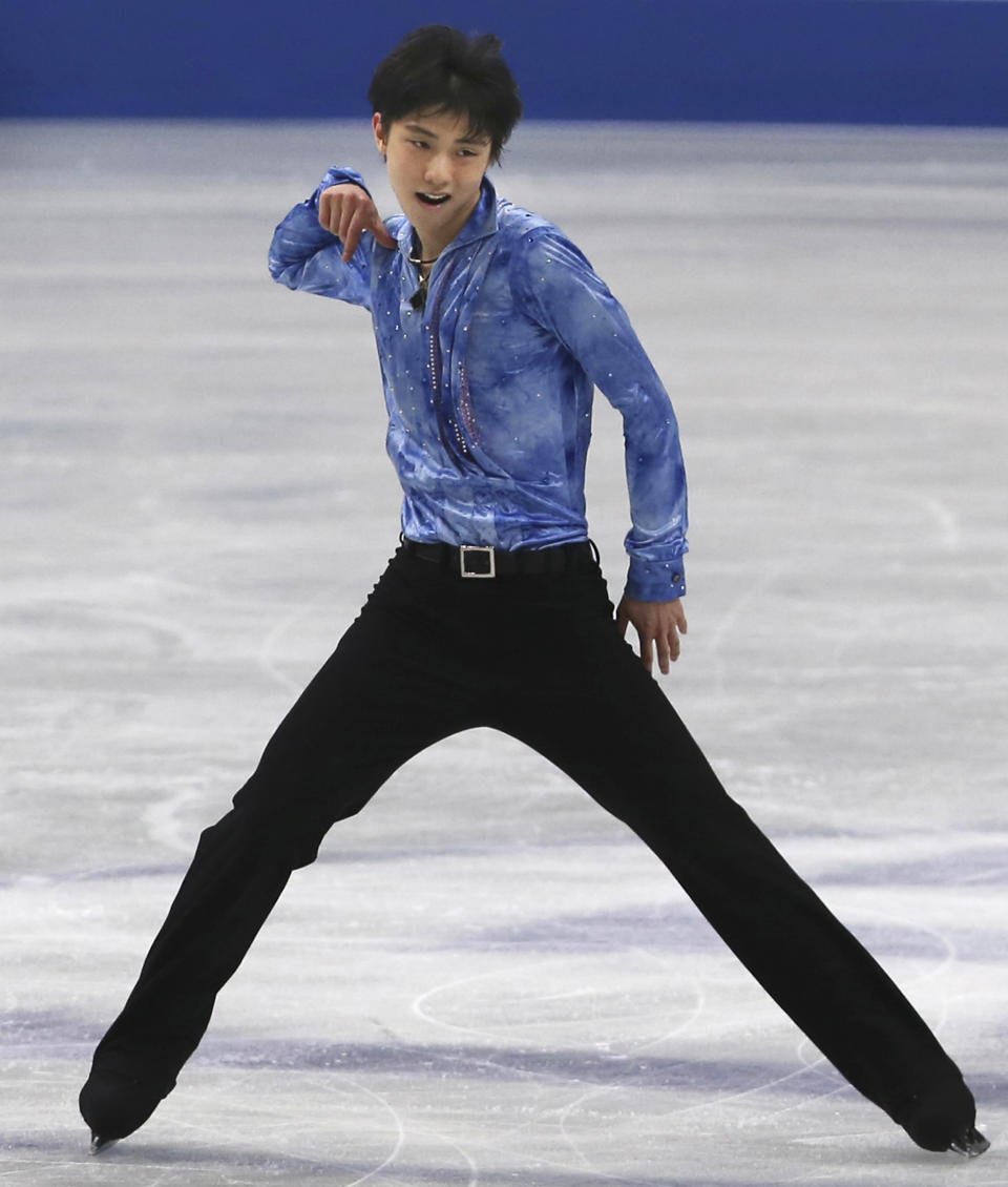 Yuzuru Hanyu of Japan performs during a men's short program of the World Figure Skating Championships in Saitama, near Tokyo, Wednesday, March 26, 2014. (AP Photo/Koji Sasahara)