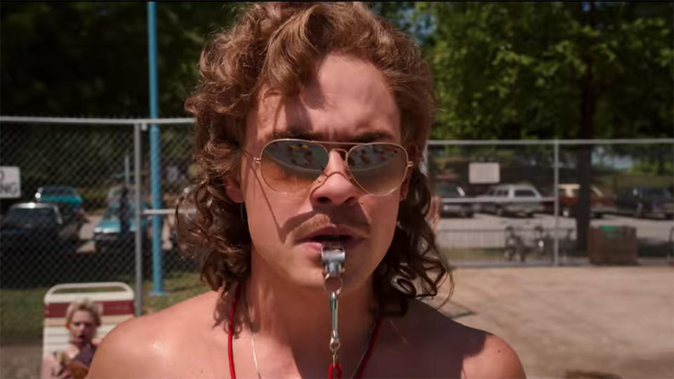 Dacre Montgomery plays Billy Hargrove pool side in Stranger Things 3