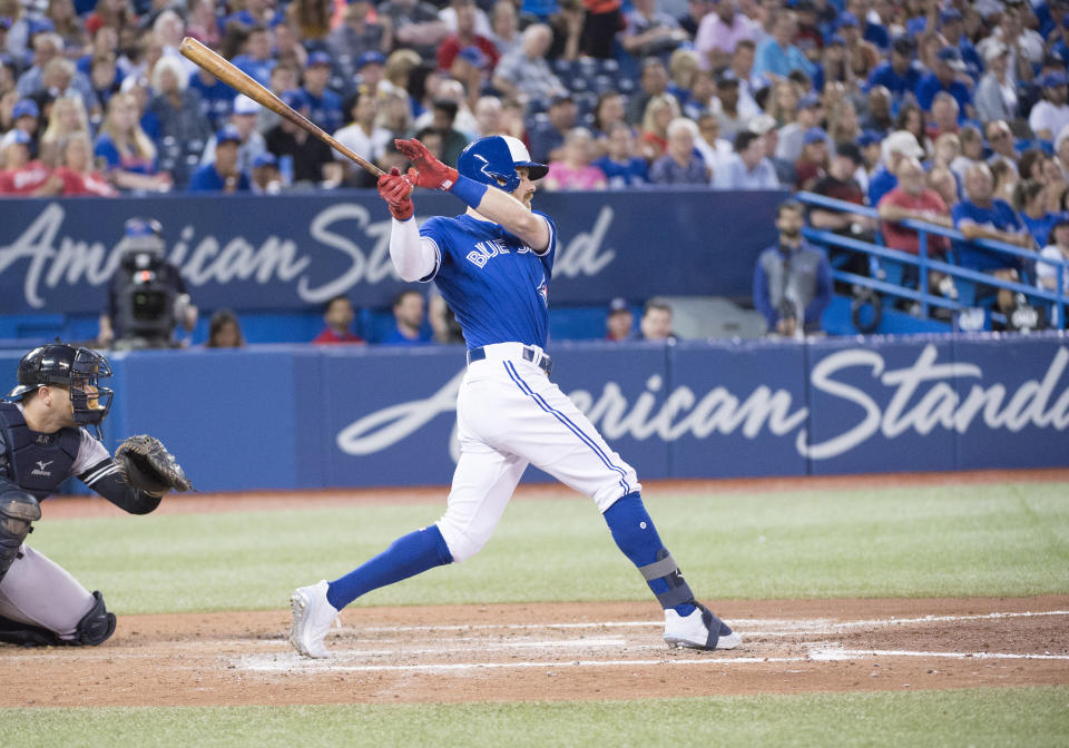 Aug 8, 2019; Toronto, Ontario, CAN;Toronto Blue Jays center fielder Derek Fisher (20) hits a home run during the fifth inning against the New York Yankees at Rogers Centre. Mandatory Credit: Nick Turchiaro-USA TODAY Sports