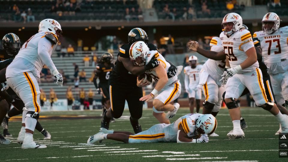 A Southern Miss football defender tackles ULM quarterback Jiya Wright in a 24-7 win at M.M. Roberts Stadium on Nov. 4, 2023.