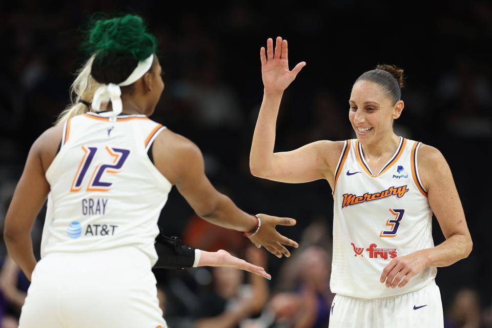 Diana Taurasi #3 of the Phoenix Mercury high-fives Reshanda Gray #12 after scoring against the Indiana Fever during the first half of the WNBA game at Footprint Center on June 27, 2022, in Phoenix, Arizona.