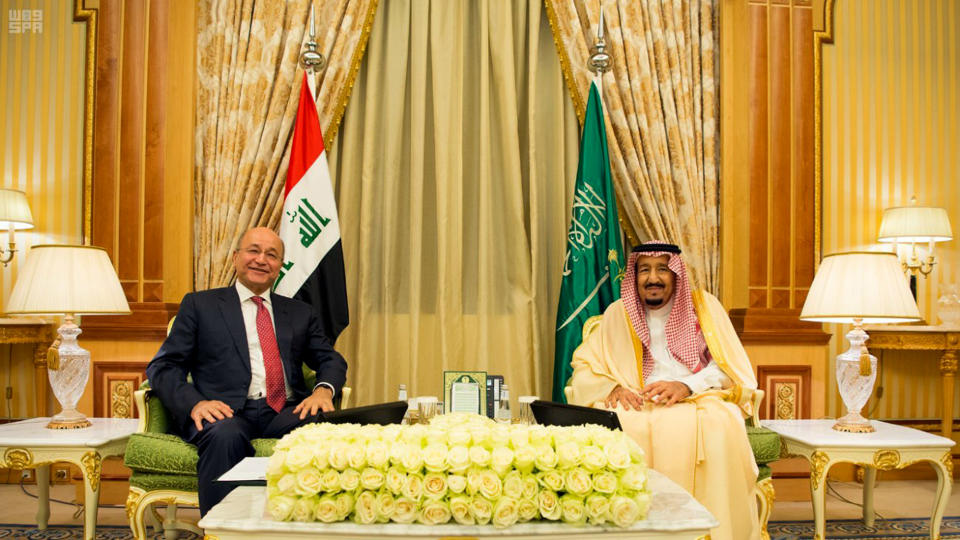 In this photo provided by the Saudi Press Agency, Saudi King Salman, right, meets with with Iraqi President Barham Salih, in Riyadh, Saudi Arabia, Sunday, Nov. 18, 2018. Salman met with Salih a day after the Iraqi official visited the kingdom's rival, Iran. Salih's back-to-back visits to Iran and Saudi Arabia reflect the delicate balance Iraq seeks to maintain in a region where its two powerful neighbors are battling for supremacy. (AP Photo/Saudi Press Agency)