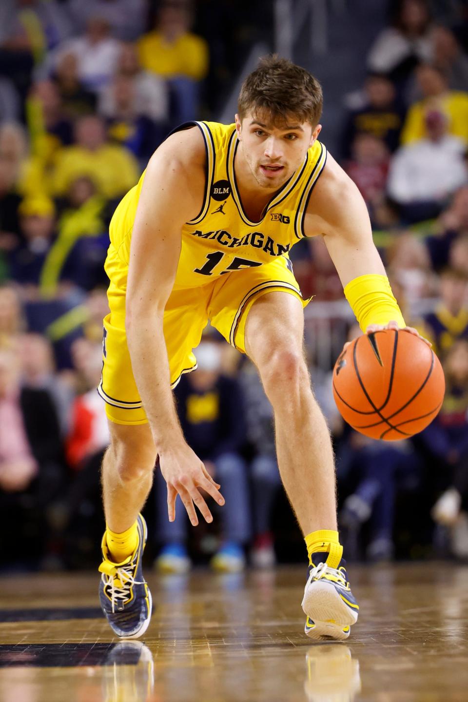 Michigan guard Joey Baker dribbles in the first half of U-M's 62-61 loss on Saturday, Feb. 11, 2023, at Crisler Center.