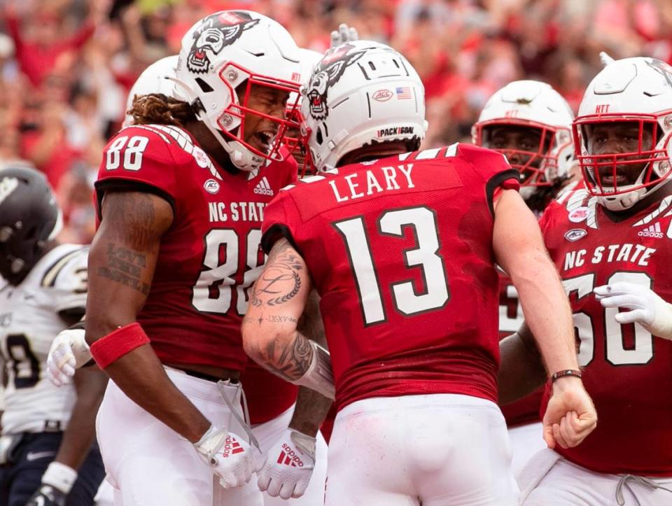 N.C. State’s Devin Carter (88) celebrates with quarterback Devin Leary (13) after Leary scored on 12-yard touchdown run in the first half of N.C. State’s game against Charleston Southern at Carter-Finley Stadium in Raleigh, N.C., Saturday, Sept. 10, 2022.