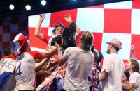 Soccer Football - World Cup - The Croatia team return from the World Cup in Russia - Zagreb, Croatia - July 16, 2018 Croatia players throw Croatia coach Zlatko Dalic in the air REUTERS/Antonio Bronic