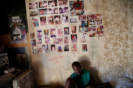 Bubacar Samba, a Gambian migrant who voluntarily returned from Libya, sits on a bed at his home in Brikama, Gambia April 5, 2017. REUTERS/Luc Gnago