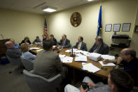 FILE - From center left, clockwise, in blue shirt, John Starr, chairman of the Joint Pension Board, first selectman Ken Flatto , and Paul H. Hiller Jr. chief fiscal officer of the Town of Fairfield Conn., discuss with other town representatives, Monday Dec. 15, 2008, in Fairfield Conn., the fallout of money for the Town of Fairfield pension fund of which nearly 15 percent of the fund's total value were entrusted to Bernard Madoff. More than 12 years after Madoff confessed to running the biggest financial fraud in Wall Street history, a team of lawyers is still at work on a sprawling effort to recover money for the thousands of victims of his scam. (AP Photo/Douglas Healey, File)