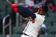 Atlanta Braves' Ozzie Albies drives in arun with a double in the first inning of a baseball game against the New York Mets Tuesday, April 9, 2024, in Atlanta. (AP Photo/John Bazemore)