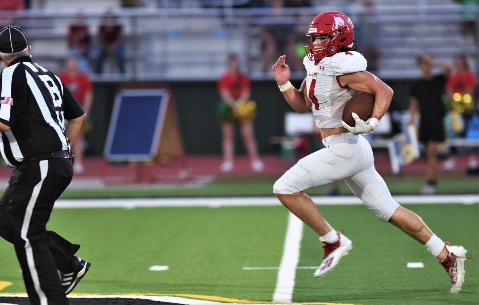 Albany's Coy Lafevre runs for a 96-yard touchdown against Dublin. The play was erased by a sideline infraction. Adam Hill later ran 42 yards for a TD on the same drive, giving the Lions a 35-7 lead with 1:29 left in the first half.