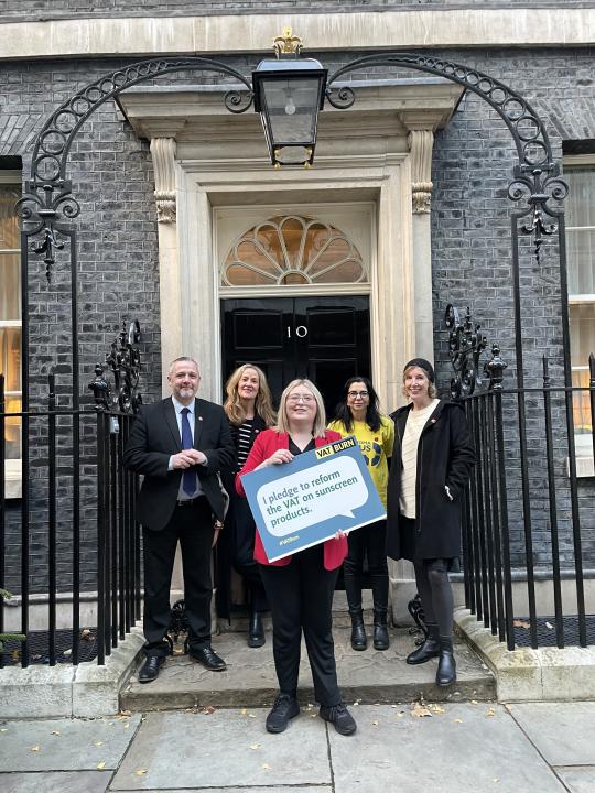 Campaigners deliver a petition calling for VAT to be removed from sunscreen to 10 Downing Street (VAT Burn/PA)