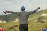 Tiger Woods of the United States celebrates after getting a birdie on the 16th green during the first round of the British Open Golf Championships at Royal Portrush in Northern Ireland, Thursday, July 18, 2019.(AP Photo/Jon Super)