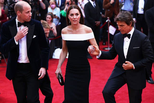 <p>Dan Kitwood/POOL/AFP/Getty </p> Prince William, Kate Middleton and Tom Cruise at the Top Gun: Maverick premiere in London in May 2022.