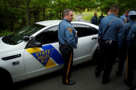 New Jersey State Troopers gather before escorting President Trump as he leaves his golf estate home in Bedminster, in May. REUTERS/Jonathan Ernst