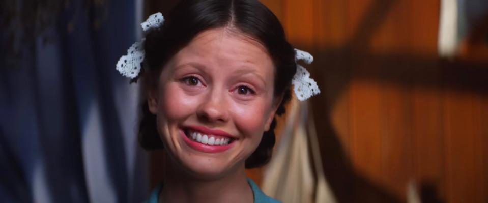 Mia Goth making a creepy smile