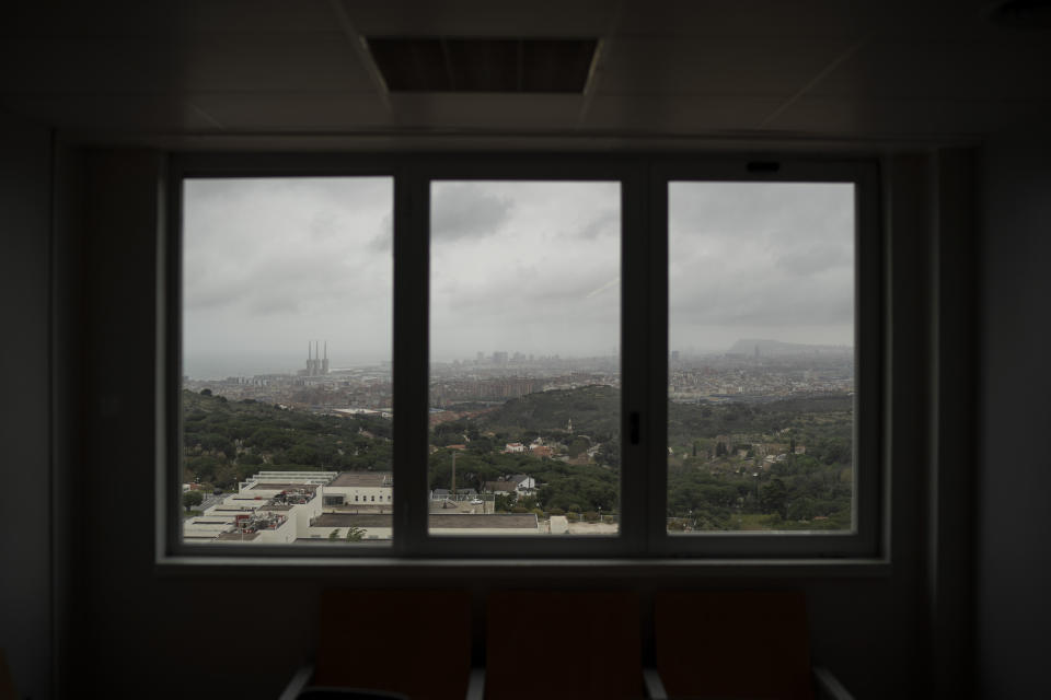 Badalona is seen through a window of the Germans Trias i Pujol hospital in Badalona, Barcelona province, Spain, Wednesday, April 1, 2020. (AP Photo/Felipe Dana)