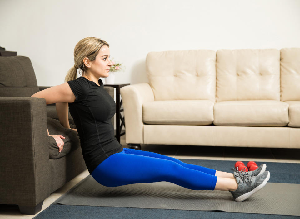 woman performing tricep dips at-home arm exercises for flabby triceps