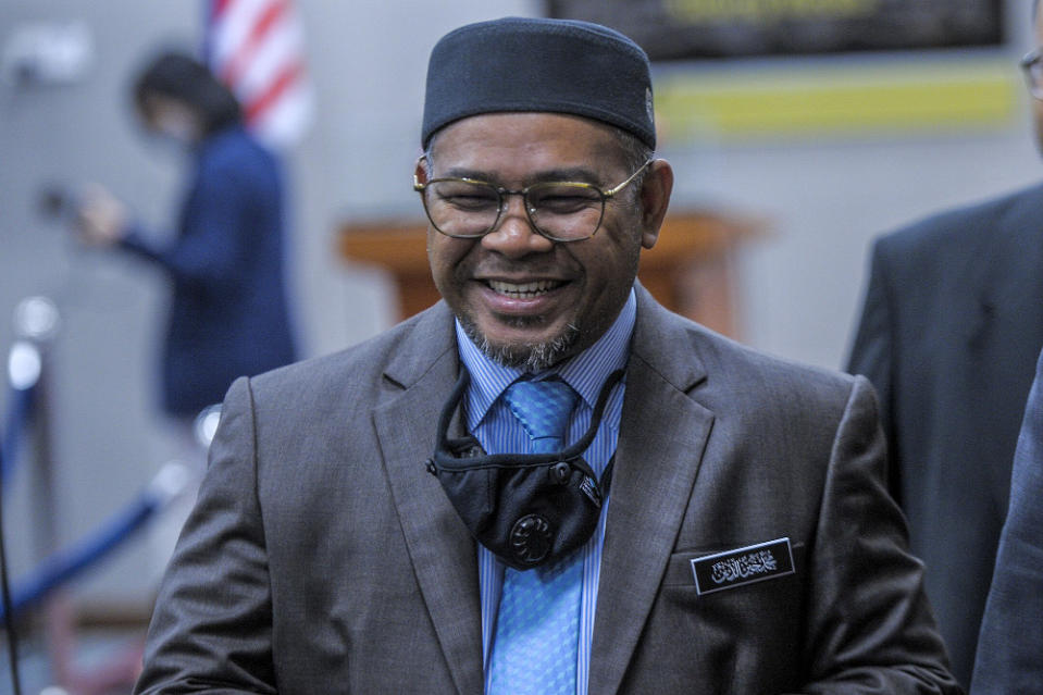 Minister of Plantation Industries and Commodities Datuk Mohd Khairuddin Aman Razali speaks to reporters during a press conference in Parliament on August 5, 2020. — Picture by Shafwan Zaidon