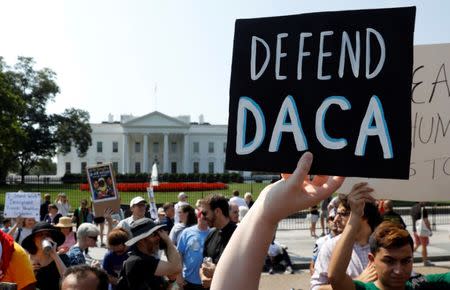 FILE PHOTO: Demonstrators protest in front of the White House after the Trump administration today scrapped the Deferred Action for Childhood Arrivals (DACA), a program that protects from deportation almost 800,000 young men and women who were brought into the U.S. illegally as children, in Washington, U.S., September 5, 2017. REUTERS/Kevin Lamarque